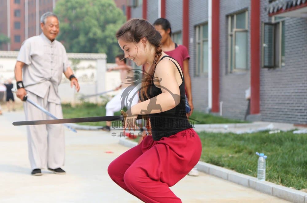 Sabina in a low sword pose