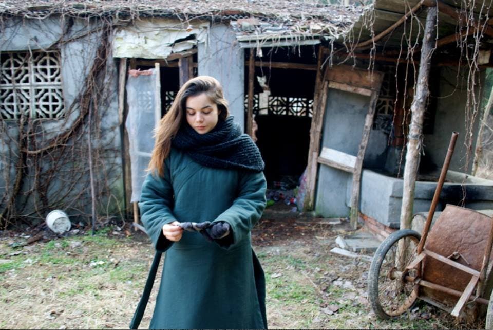 Sabina holding a sword