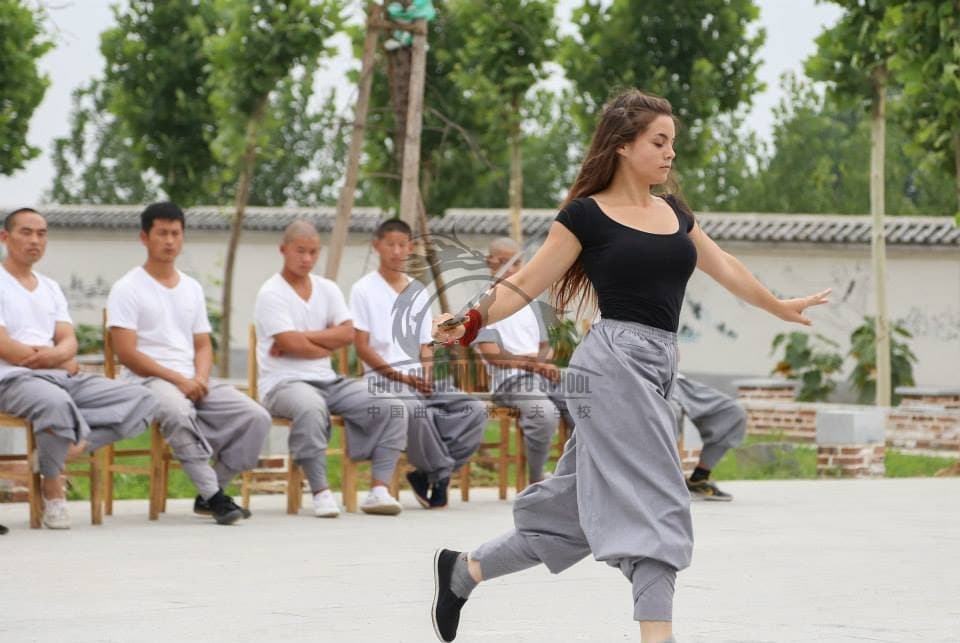 Sabina practicing a flowing sword movement